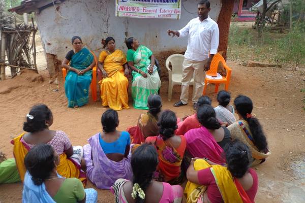 A women's self-help group at a financial literacy session in the hamlet.