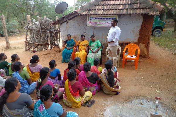 A NABARD financial literacy session with a women's self-help group, N.M. Kulam.