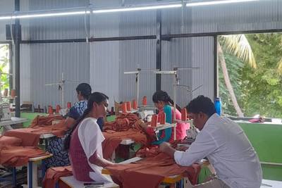 A garment unit giving women work within reach of home.
